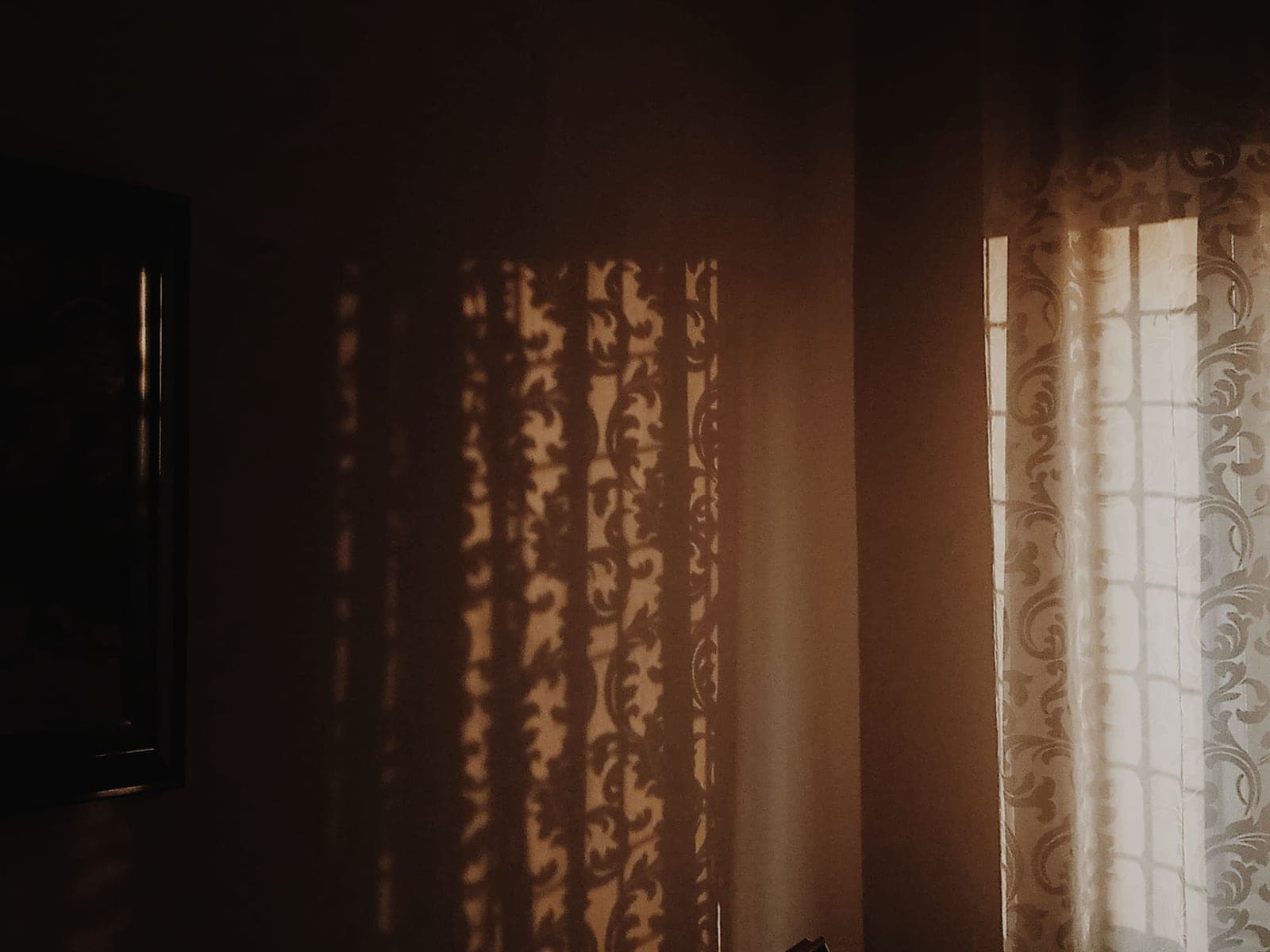 Seasonal sunlight falling through a window into a quiet room