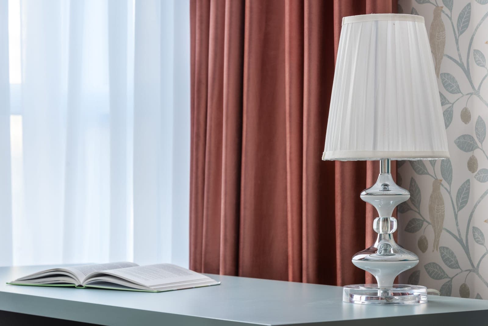 Close-up of a pleated curtain header showing the fabric folds